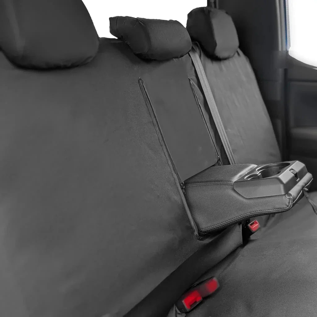 Rear seat cover with dark gray fabric and foldable console insert near latch