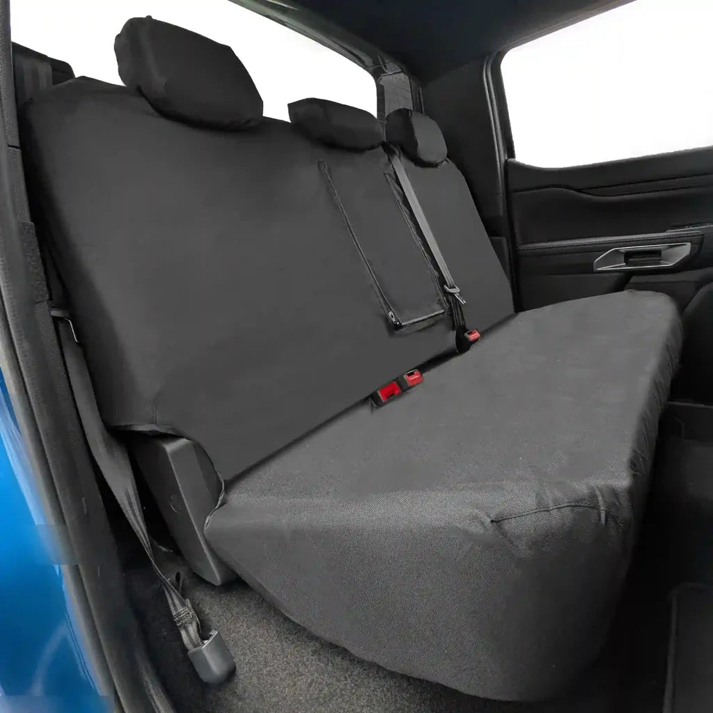 Rear seat covers in dark gray with stitched panels and headrest covers