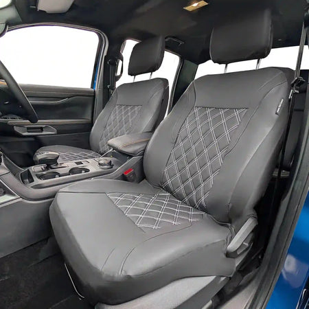 Front seat covers in gray leatherette with diamond stitch on seat and backrest