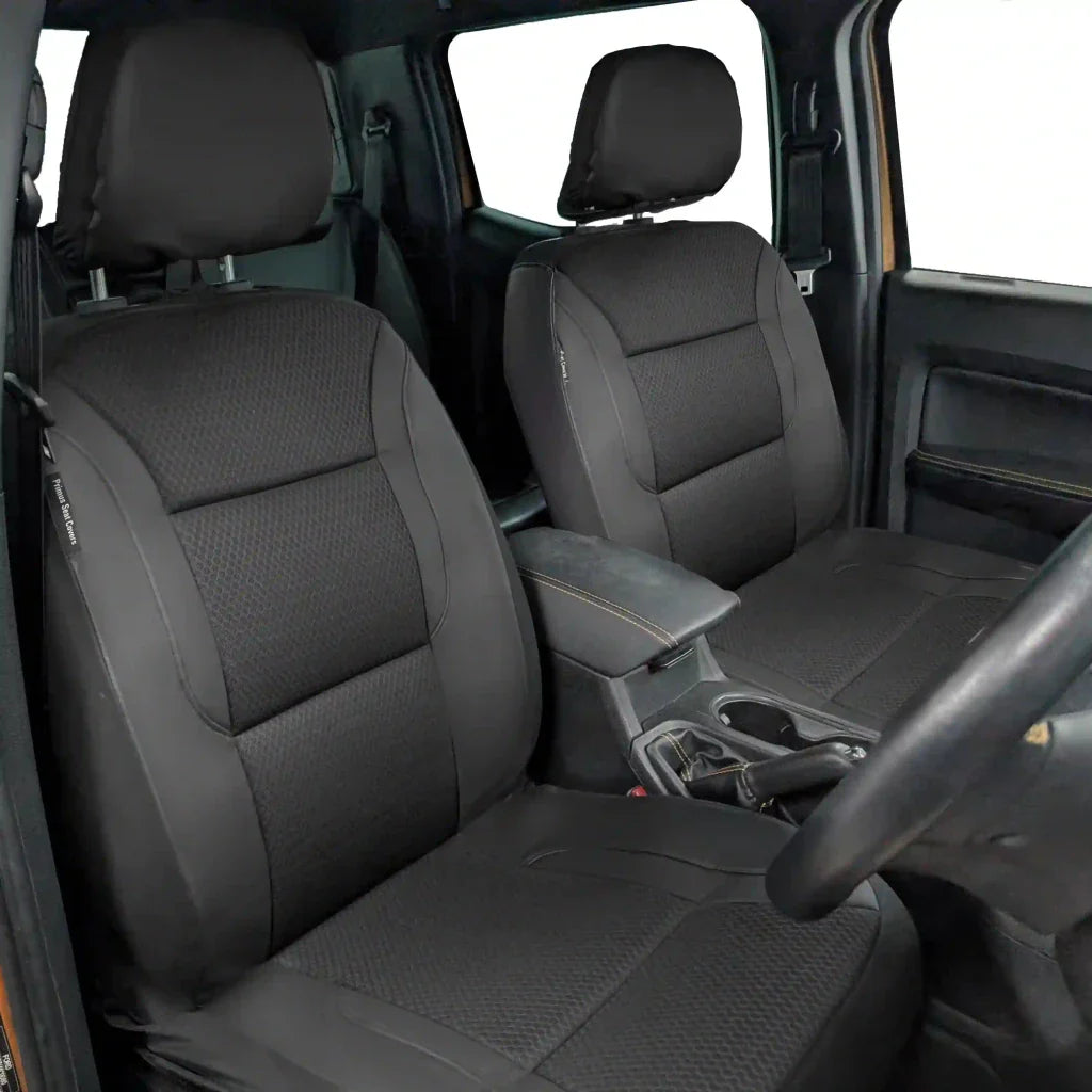 Installed front seat covers: gray textured seat and back with dark headrest and sides