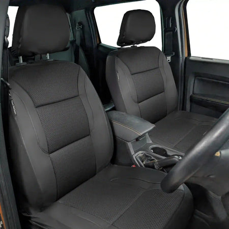 Installed front seat covers: gray textured seat and back with dark headrest and sides
