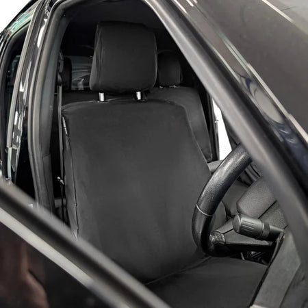 Front seat cover set: black full-seat cover with headrest, viewed from open door
