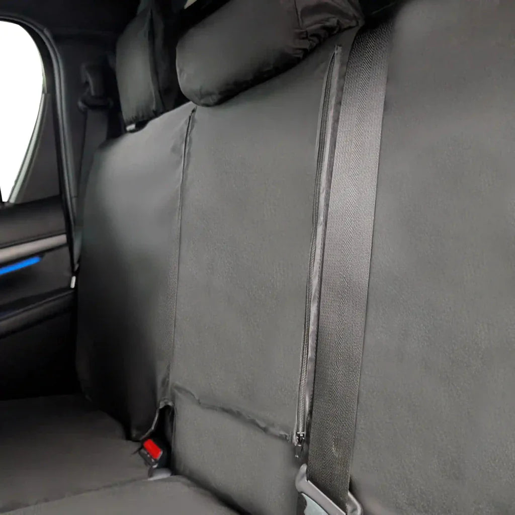 Rear seat cover side panel in gray with fastening strap and seatbelt anchor area