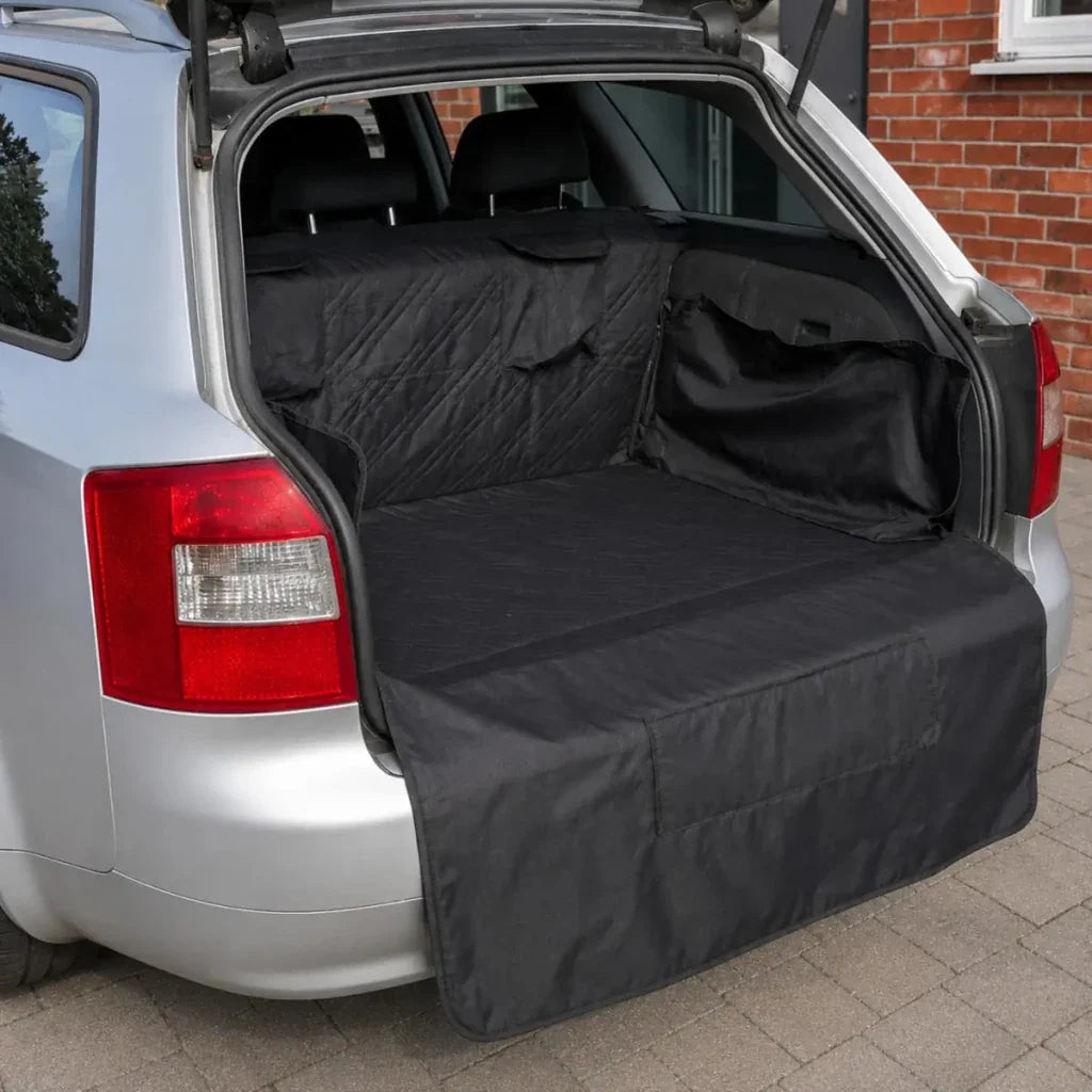 Black car boot liner spread in open car trunk, padded protective mat for cargo